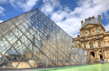 PARIS - JUNE 06: Glass Pyramid and Louvre (former Royal Palace)